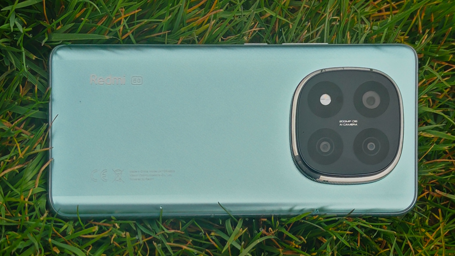 Xiaomi Redmi Note 14 Pro Plus 5G phone in hand and on grass showing homescreens and cameras up close