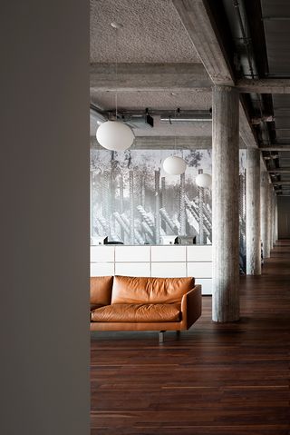 Long corridors are framed by concrete columns, giving the architecture a monumental effect