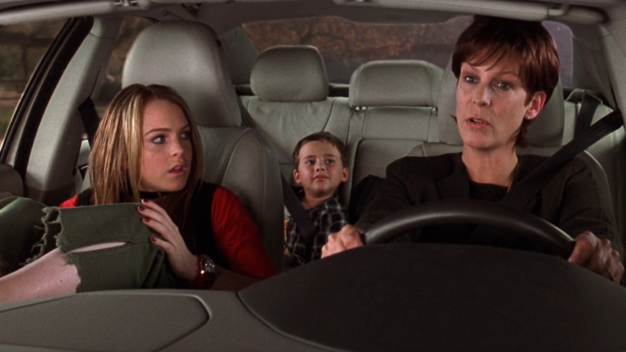 From left to right: Anna with her feet on the dash, her little brothe rin the back seat, and Tess driving.