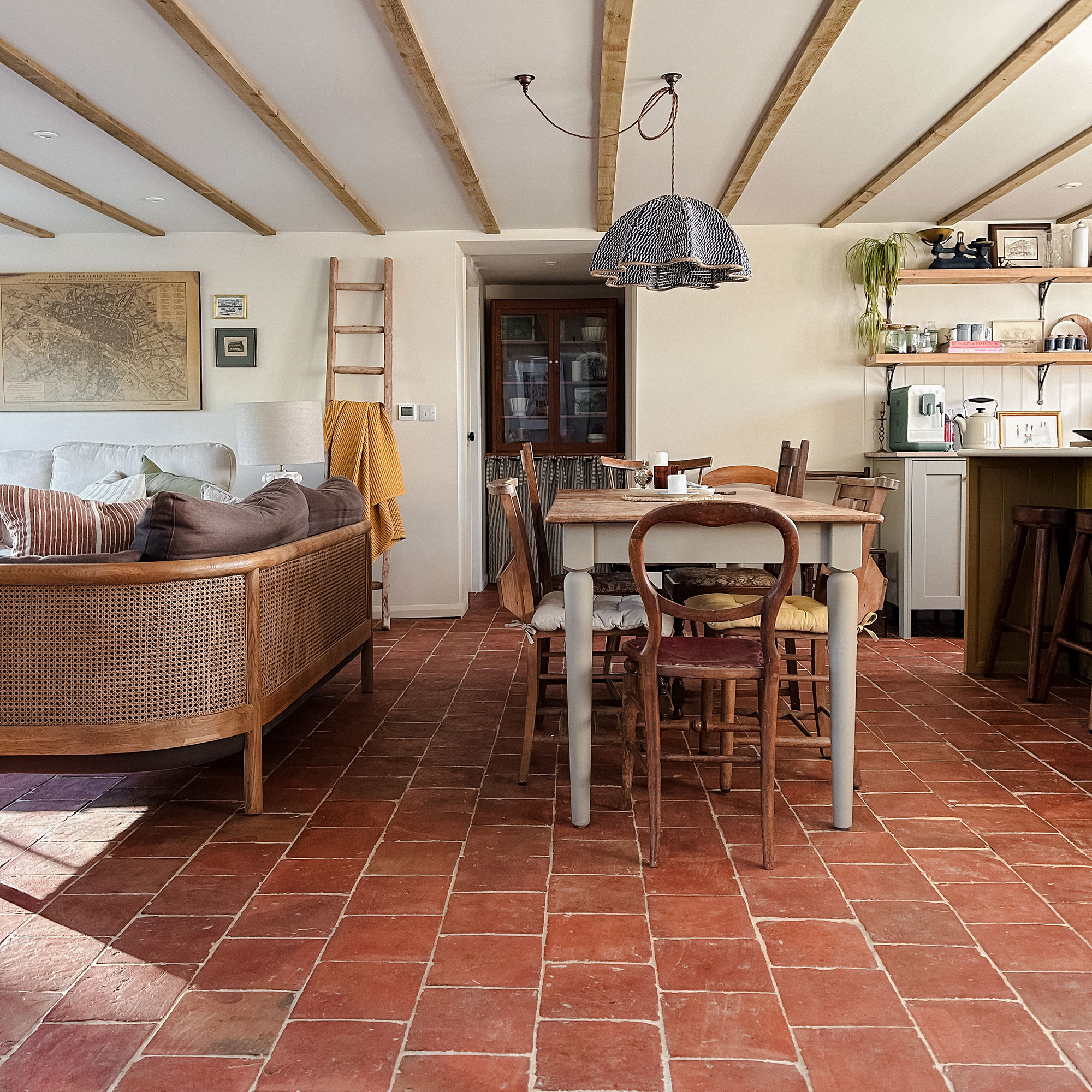 Kitchen/dining/living room with wooden ceiling beams and terracotta tiled flooring