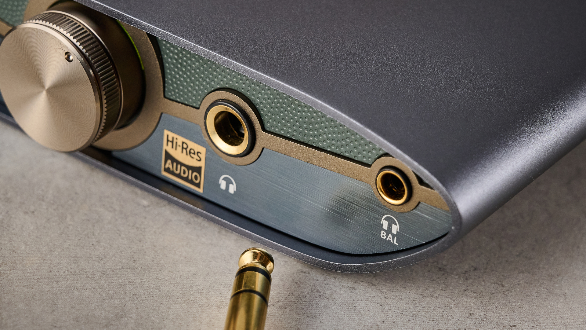 A closeup of the front of the iFi Zen DAC 3, showing its volume knob, 6.3mm jack input and 4.4mm balanced input.