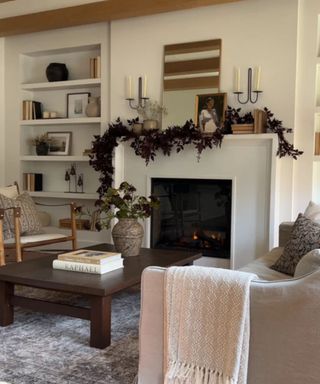 fall mantel ideas neutral living room with dark red faux foliage garland