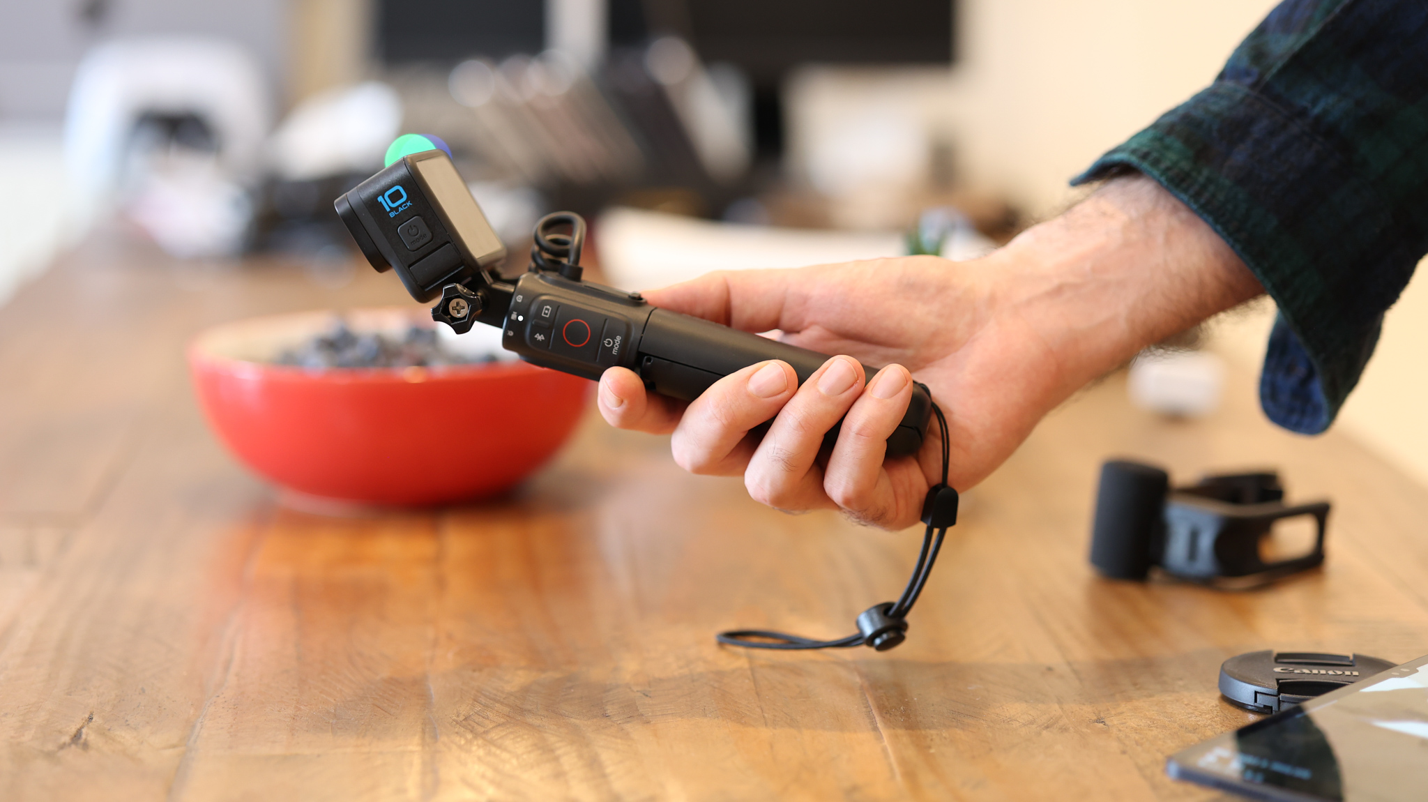 A hand holding the GoPro Volta tripod grip