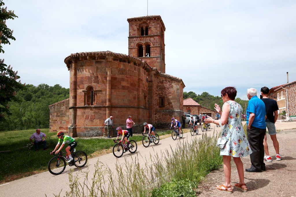 LAGUNAS DE NEILA SPAIN MAY 22 Lotte Kopecky of Belgium Green Points Jersey Anna Shackley of United Kingdom and Team SD Worx Elise Chabbey of Switzerland and Team CanyonSRAM Racing and a general view of the peloton competing while fans cheer during the 7th Vuelta a Burgos Feminas 2022 Stage 4 a 1251km stage from Covarrubias to Lagunas de Neila 1867m VueltaBurgos BurgosFem UCIWWT on May 22 2022 in Lagunas de Neila Spain Photo by Gonzalo Arroyo MorenoGetty Images