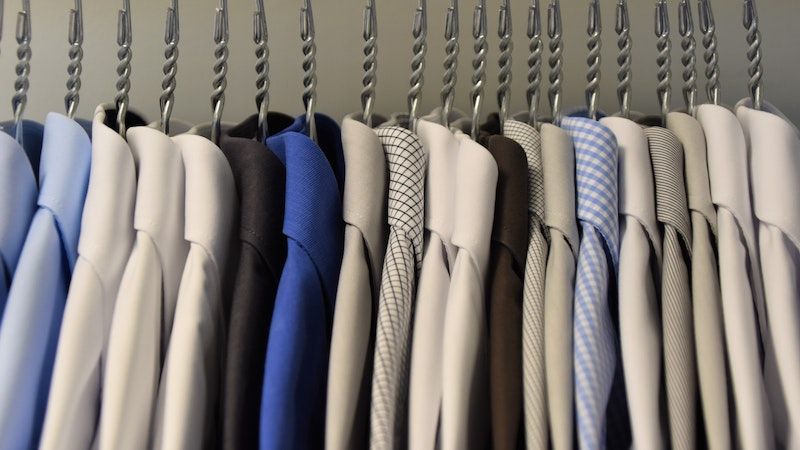 dress shirts hanging in closet