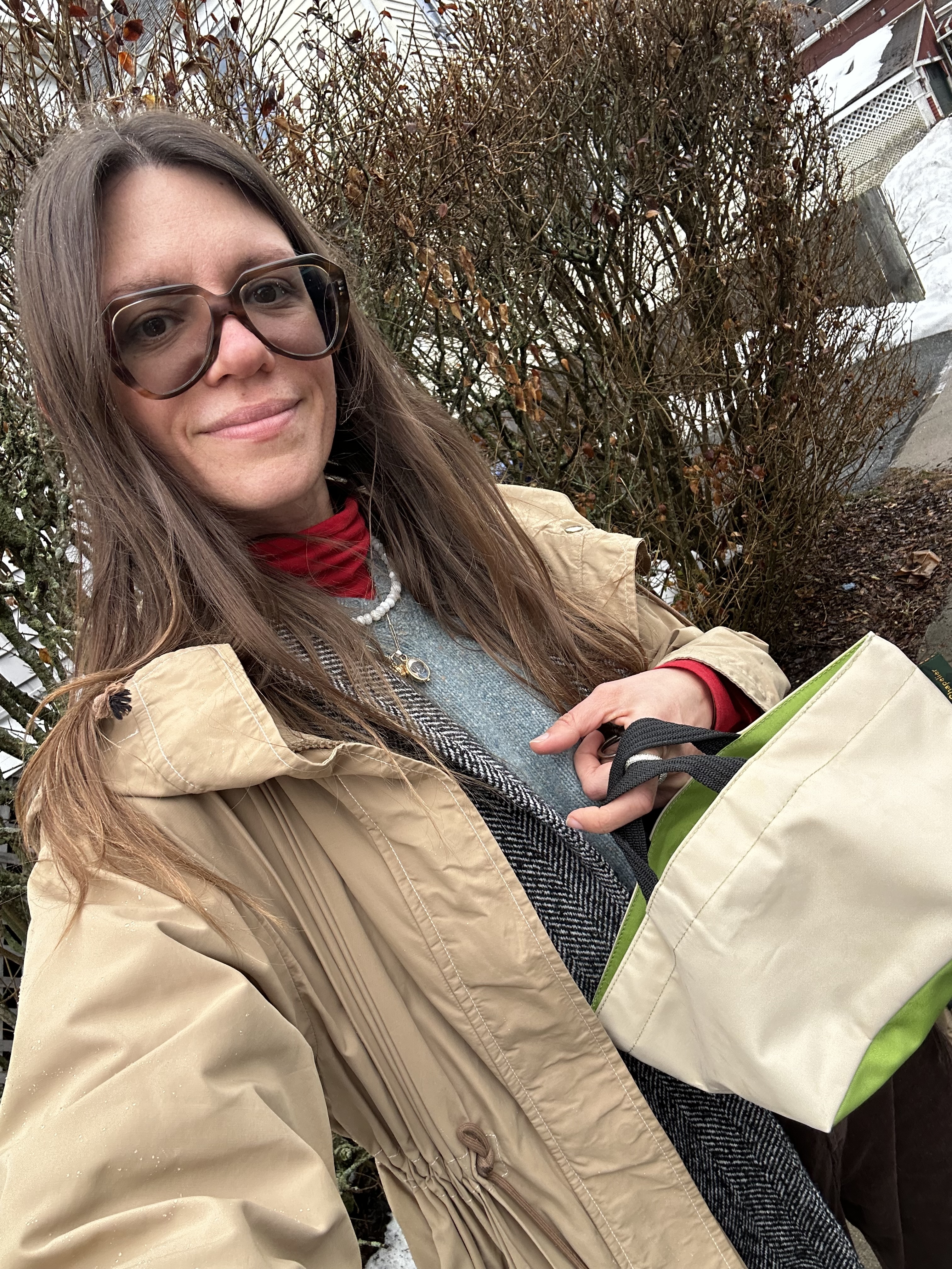 Julia Gall styles her Herv&amp;eacute; Chapelier bag with a matching nylon raincoat and layered look