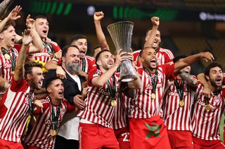 Olympiacos players celebrate their UEFA Conference League final win over Fiorentina in May 2024.