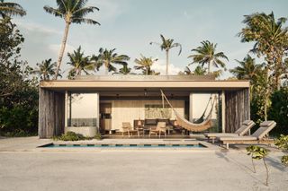 Beach hut at Patina Maldives with modern interiors