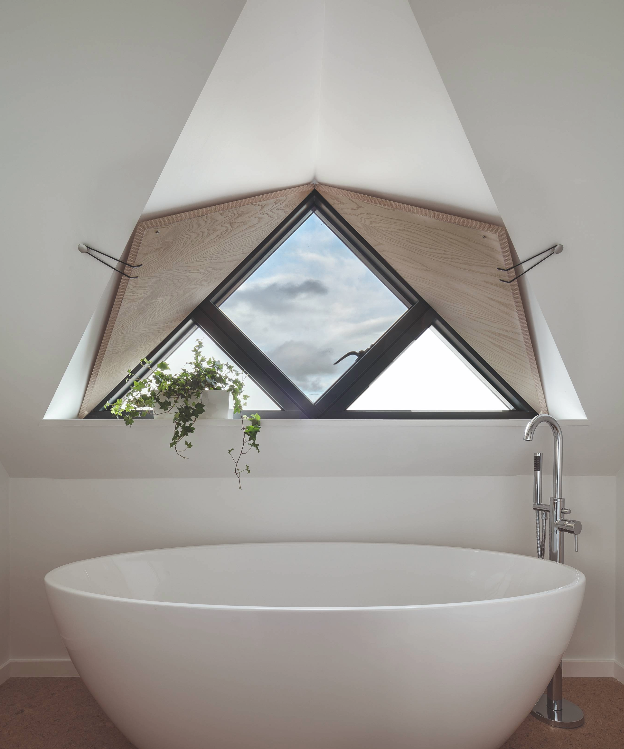 Freestanding bath under a window