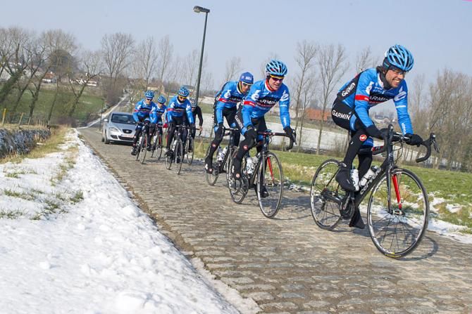 Garmin-Sharp's Thomas Dekker leads teammates Nick Nuyens and Johan Vansummeren over the cobbles.