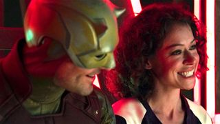 Charlie Cox as Daredevil and Tatiana Maslany as She-Hulk smiling in She-Hulk: Attorney at Law