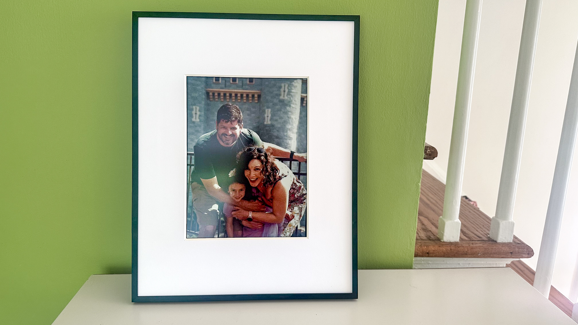 Aluratek ePaper 13.3 inch Wifi Digital Photo Frame on a shelf