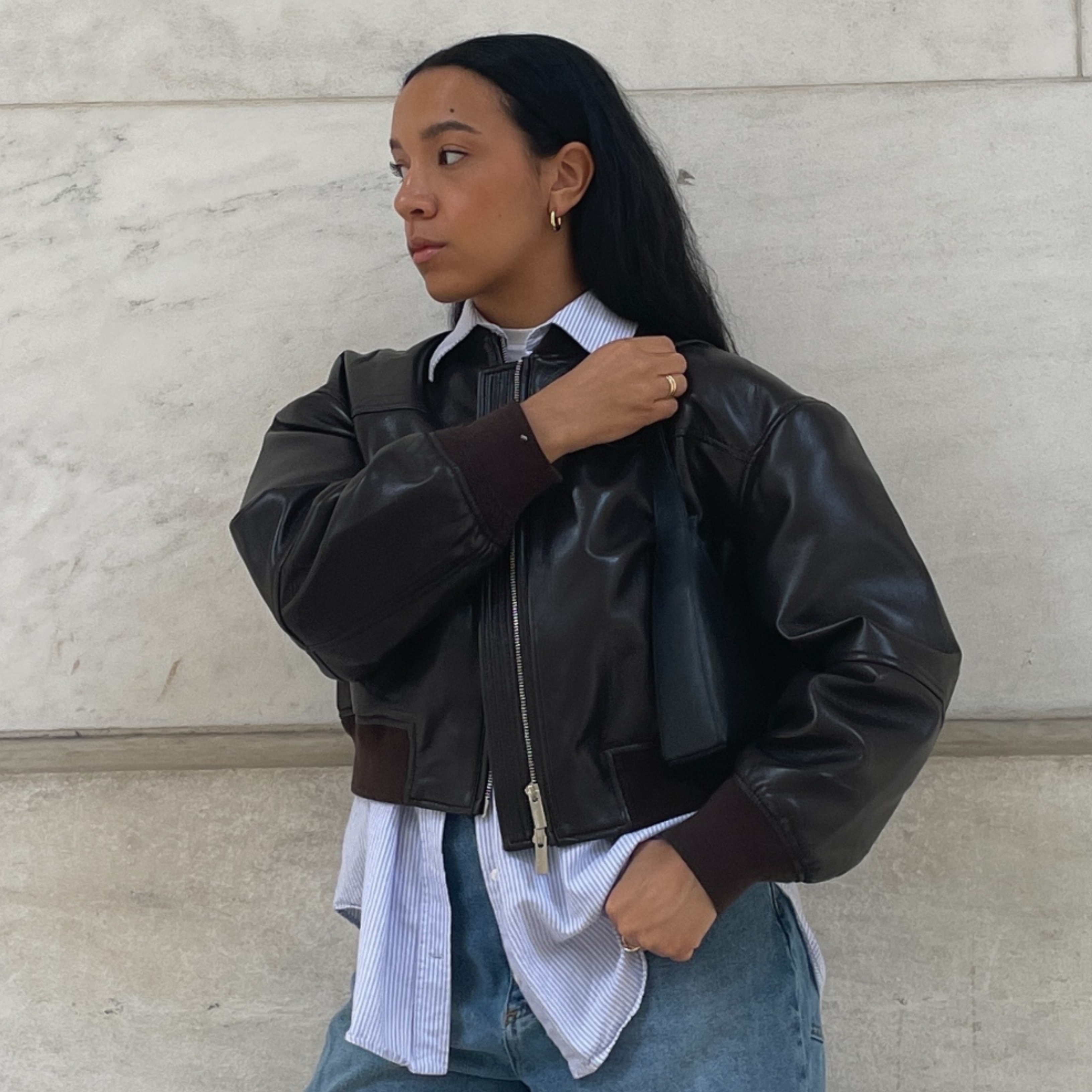Lauren Tappan wearing a leather bomber jacket 