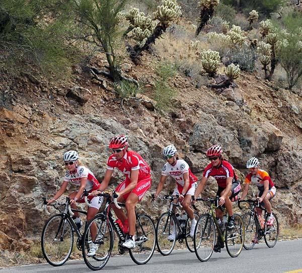 Emily Batty (Trek Bicycle Store) and Todd Wells (Specialized) lead a group of pro mountain bikers on a road ride in Tucson, Arizona