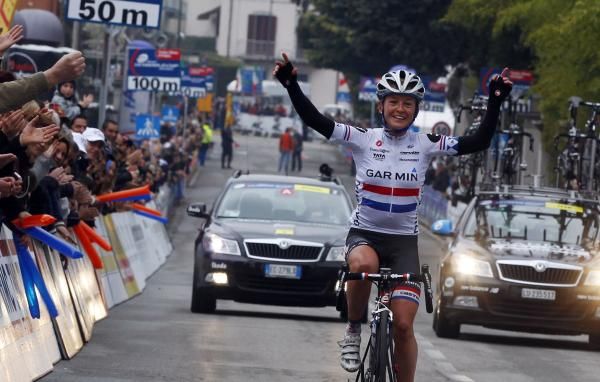 Emma Pooley (Garmin-Cervelo) celebrates in the rain after a long solo breakaway