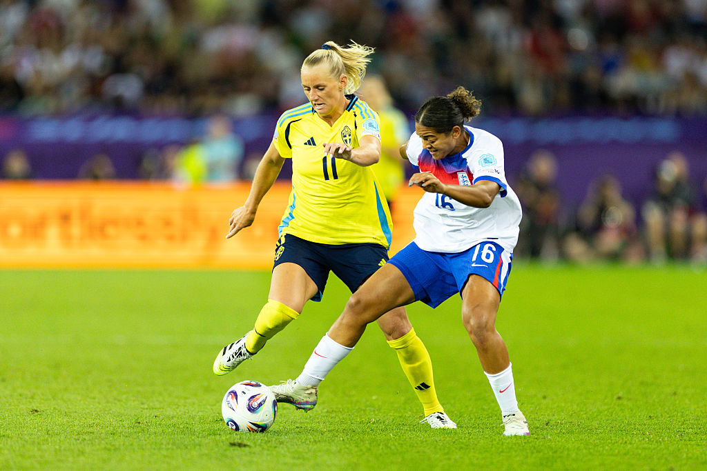Jess Carter and Stina Blackstenius battle for the ball