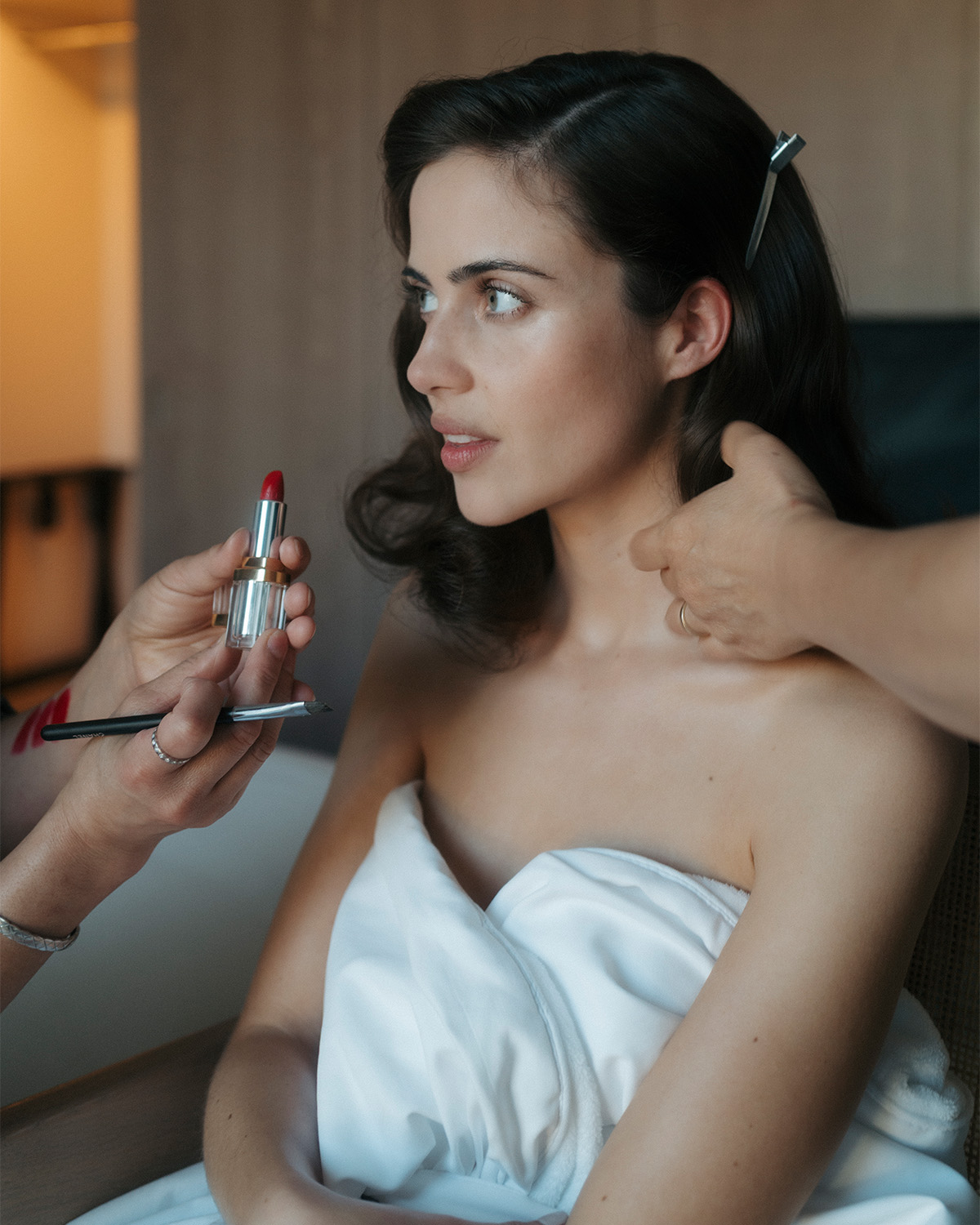 Lydia Peckham getting her hair and makeup done for the Nuremberg AFI Fest premiere. Her makeup artist is about to apply red lipstick.