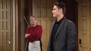Melody Thomas Scott and Mark Grossman as Nikki and Adam standing in an office in The Young and the Restless