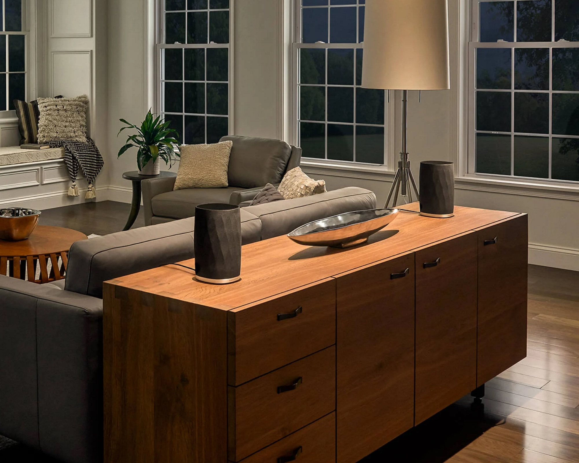 Bowers &amp;amp; Wilkins Formation Flex surround sound on a cabinet behind a sofa