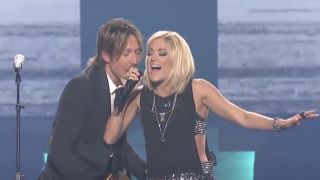 Carrie Underwood and Keith Urban performing together on American Idol in 2016