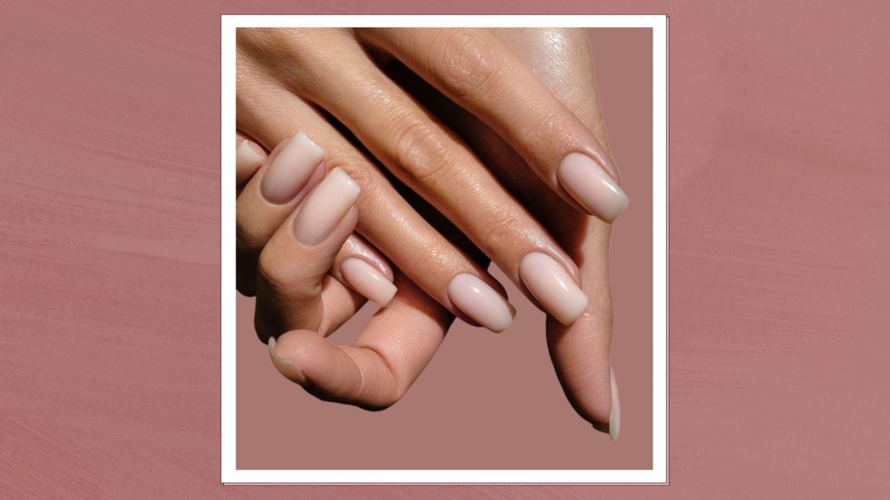 an image of a woman&#039;s hands with strong, healthy nails