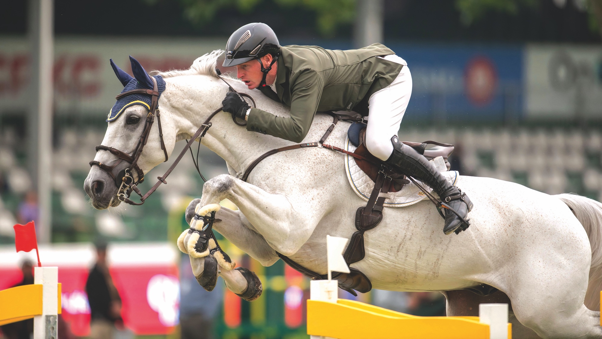 Daniel Coyle jumping on grey horse