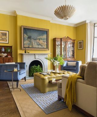 Yellow blanket, blue armchairs and rug