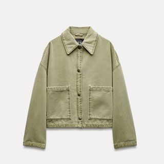 Flat lay image of green jacket