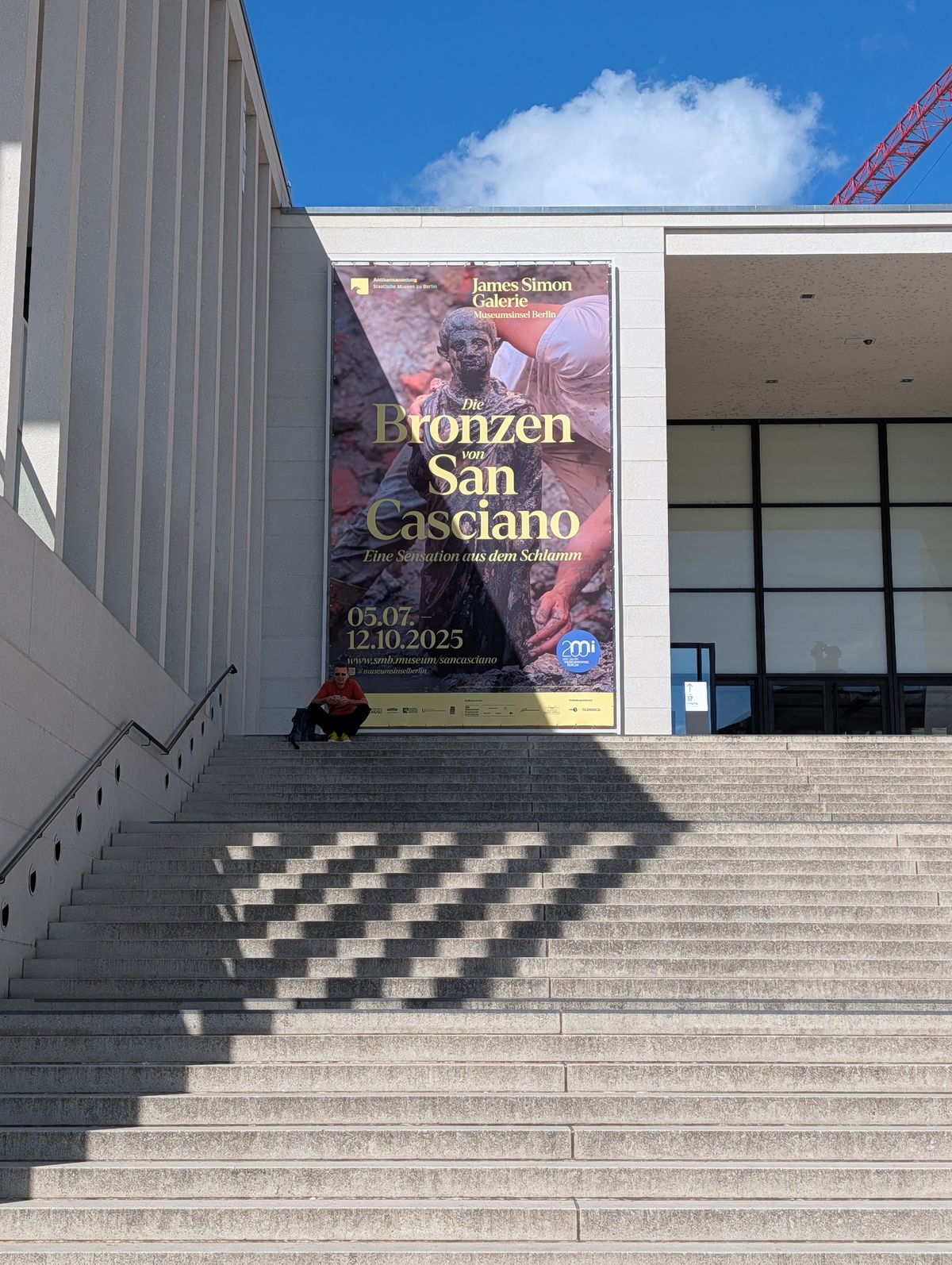 Stone steps of a gallery in Berlin advertising its next show