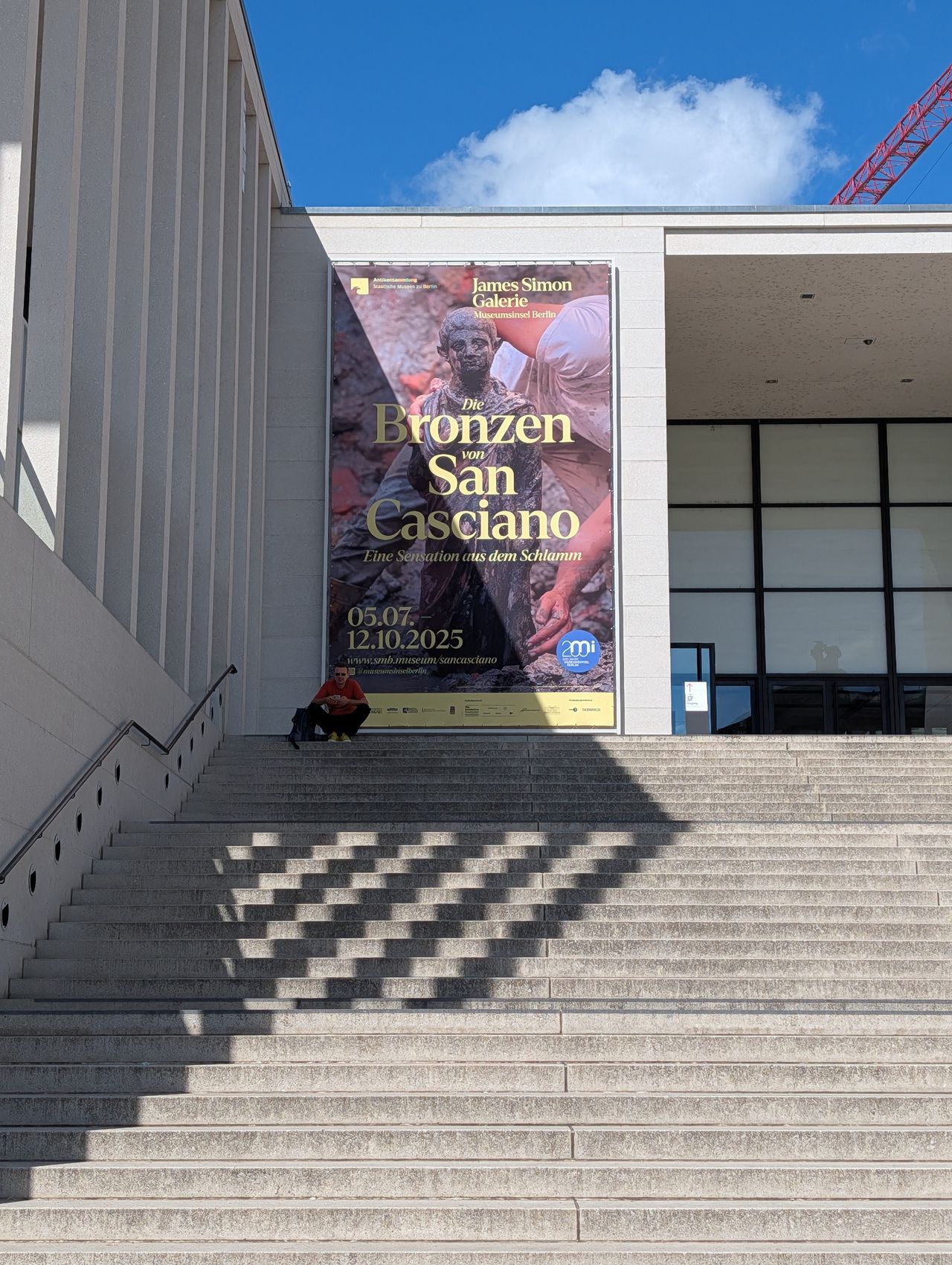 Stone steps of a gallery in Berlin advertising its next show