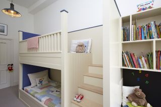 small boys bedroom with build in beds and storage