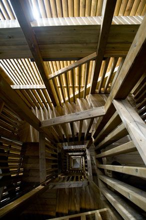 view down the inside of a winding wooden staircase