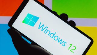 n this photo illustration, an Windows 12 logo is seen on a smartphone screen