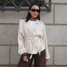 Influencer wears Bermuda shorts with heeled flip flops.