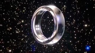 The Samsung Galaxy Ring in silver against an outer space background with stars