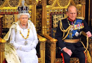 Queen Elizabeth II sits with Prince Philip, Duke of Edinburgh as she delivers her speech during the State Opening of Parliament in the House of Lords at the Palace of Westminster on June 4, 2014 in London, England