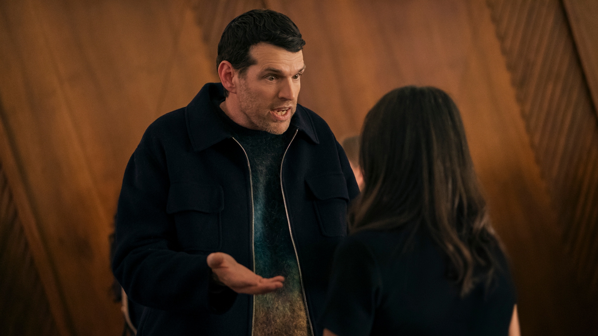 Sasha talks expressively to his wife in Nobody Wants This