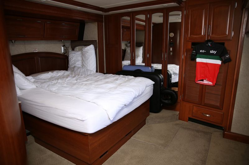 The bedroom of the motorhome with Rapha's Italian jersey hanging on the wall