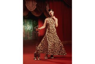 A photo of Gracie Abrams wearing a leopard print voluminous F/W 24 Marni dress with Rochas shoes and posing with a cheetah puppet forBest Knockoff Luxury Clothing
's fall issue cover story.