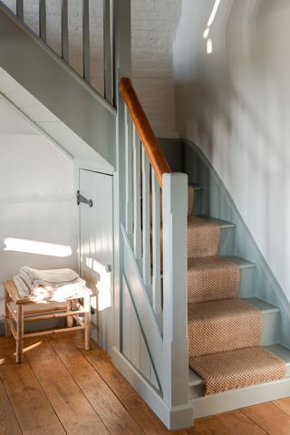 Wooden staircase painted in blue grey