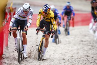 Dutch rider Mathieu Van Der Poel (L) and Belgian rider Wout van Aert compete in the Men's elite race of the 'Zilvermeer Mol' cyclocross cycling event, race 3/6 in the 'Exact Cross' competition, in Mol on December 22, 2023. (Photo by DAVID PINTENS / Belga / AFP) / Belgium OUT