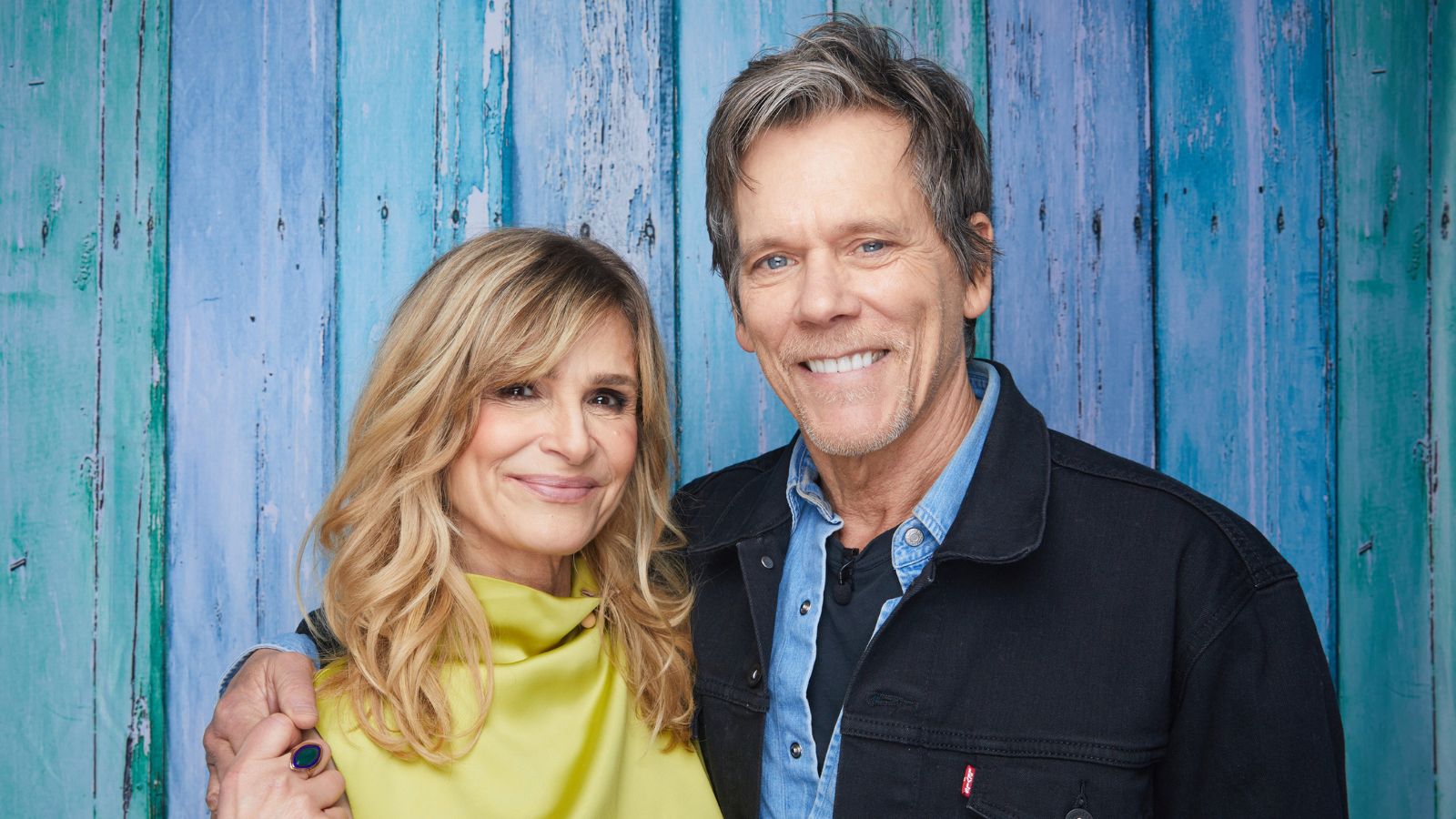 Kevin Bacon and Kyra Sedgwick on a blue background