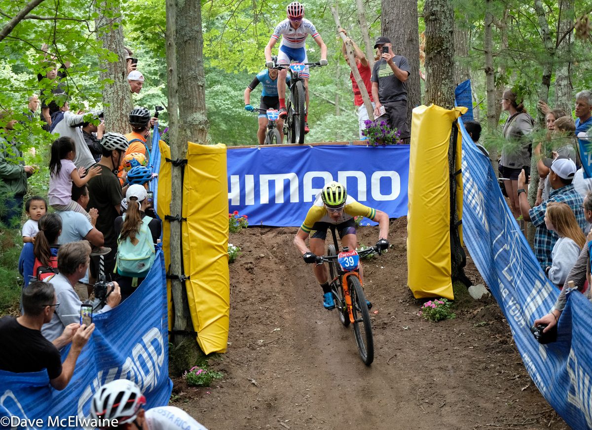 Dan McConnell (DanAndBec) riding in third position near the end of lap