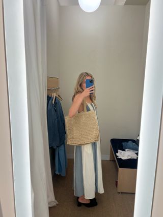 Photo of Eliza Huber in Madewell dressing room taking mirror selfie trying on clothes