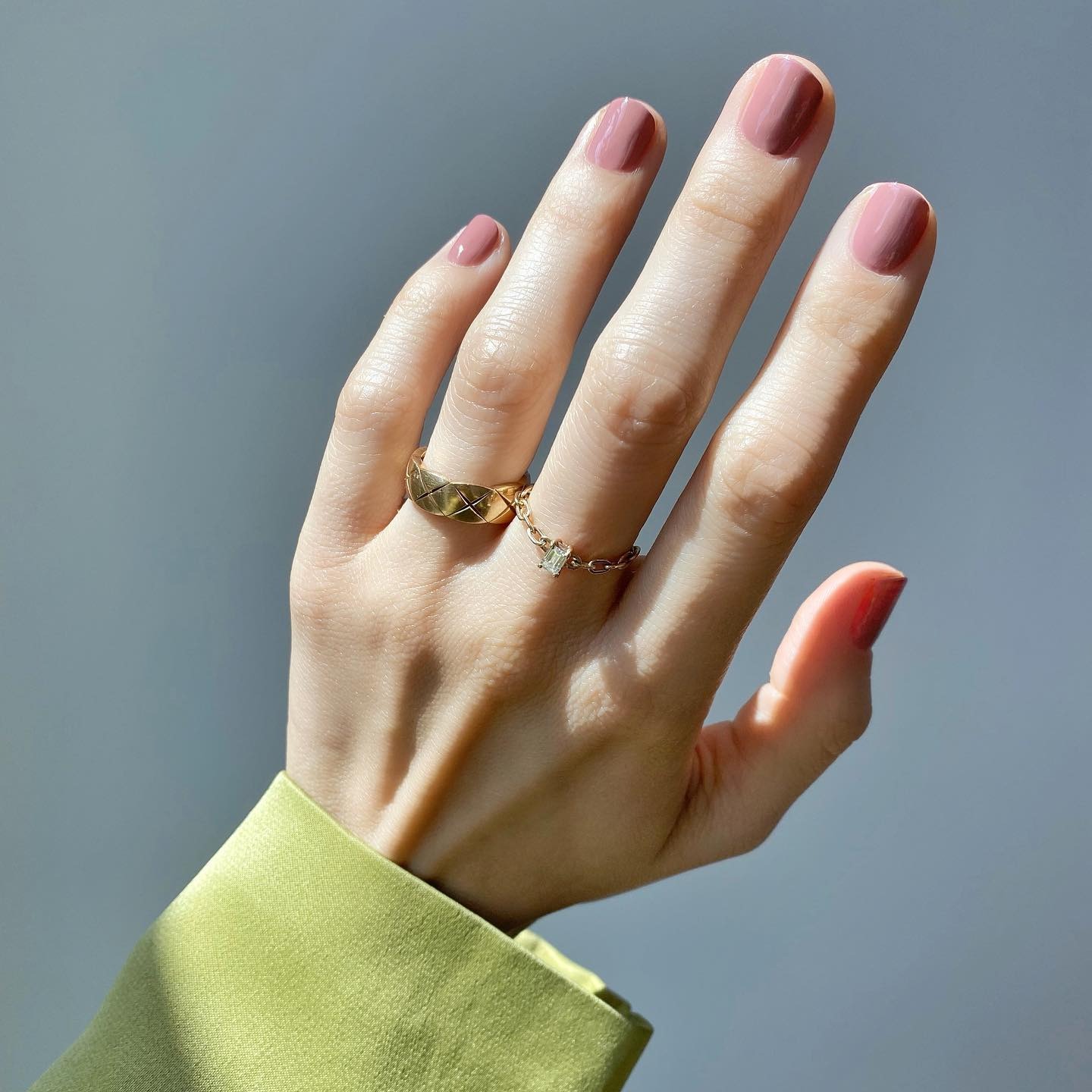 A short, square mauve manicure