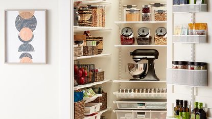 Our small kitchen pantry ideas will transform yours into one like this mini pantry with items stored in wicker baskets and uniform glass storage 