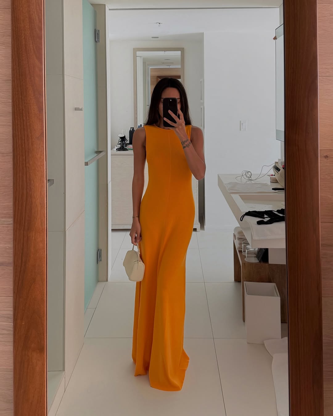 fashion influencer wearing a wedding guest dress