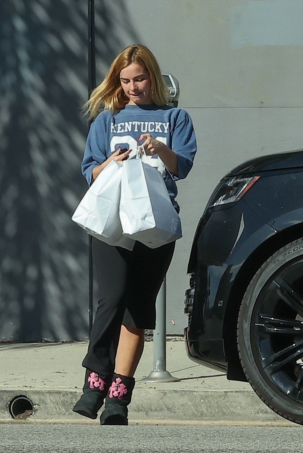 Addison Rae wearing Ugg boots from the Chrome Hearts collab