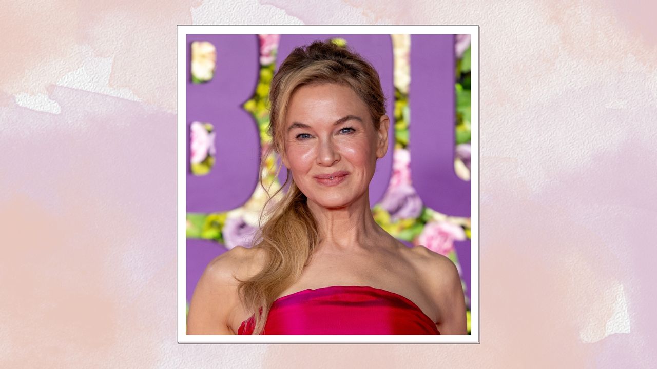 Image of Renée Zellweger smiling with curled blonde hair in a ponytail and wearing a fuchsia pink strapless dress, on a pink watercolour background