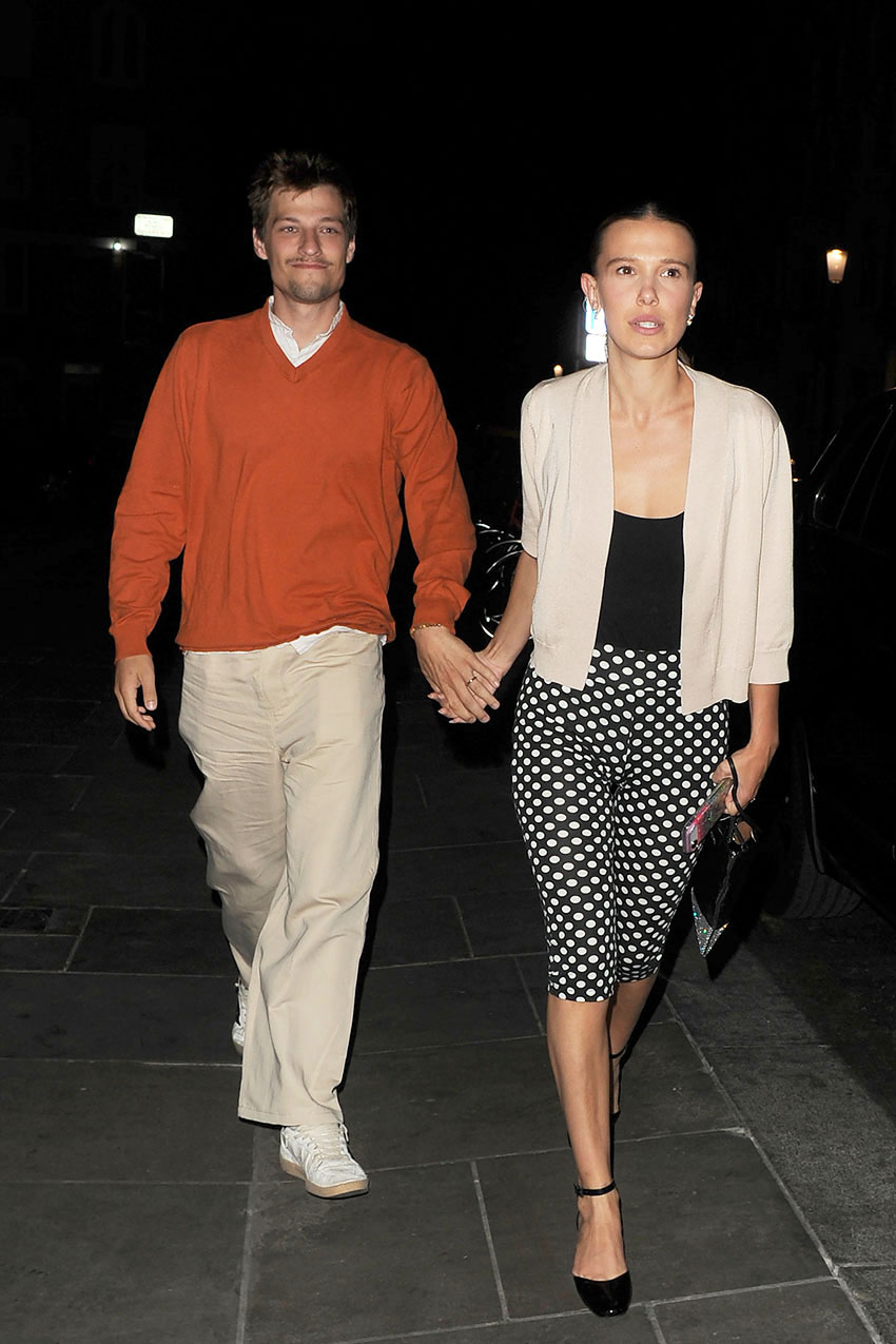 Millie Bobby Brown wearing a cardigan, polka dot capris, and ballet pumps